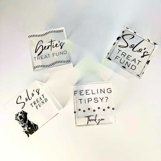 Personalizable acrylic tip jar attachments for the Solo Shot Saddle dog harness, secured with hook and loop and customized with the dog’s name and photo.