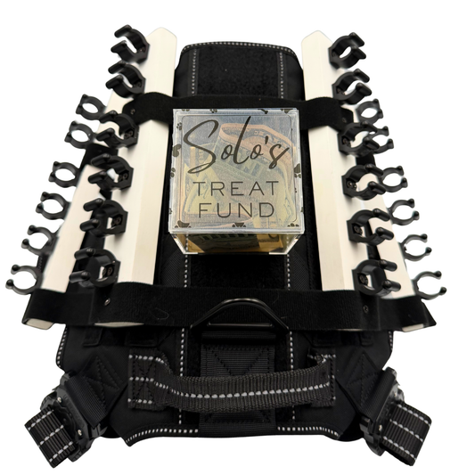 Personalizable acrylic tip jar attachments for the Solo Shot Saddle dog harness, secured with hook and loop and customized with the dog’s name and photo.