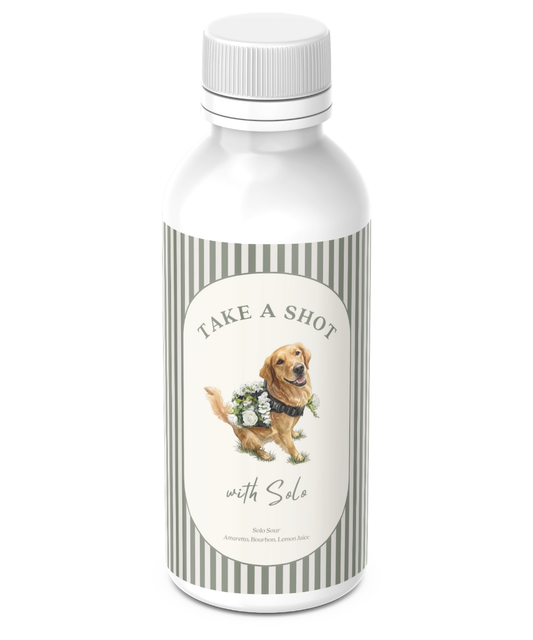 Custom 50ml mini-liquor shooter bottle wrapped in a personalized sage-striped label reading 'Take a Shot with Solo' with a golden retriever illustration and the drink recipe.