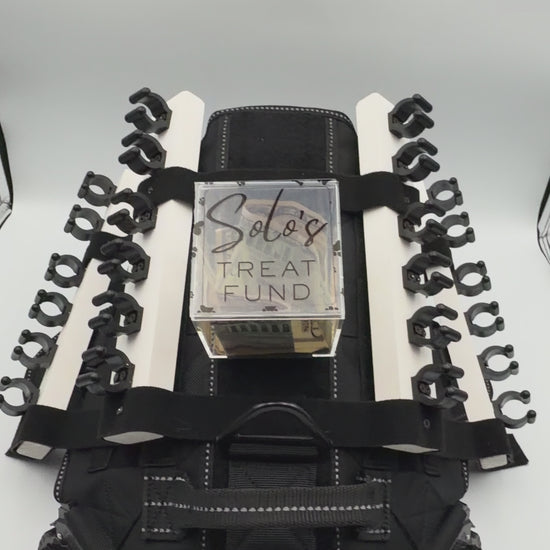 Personalizable acrylic tip jar attachments for the Solo Shot Saddle dog harness, secured with hook and loop and customized with the dog’s name and photo.